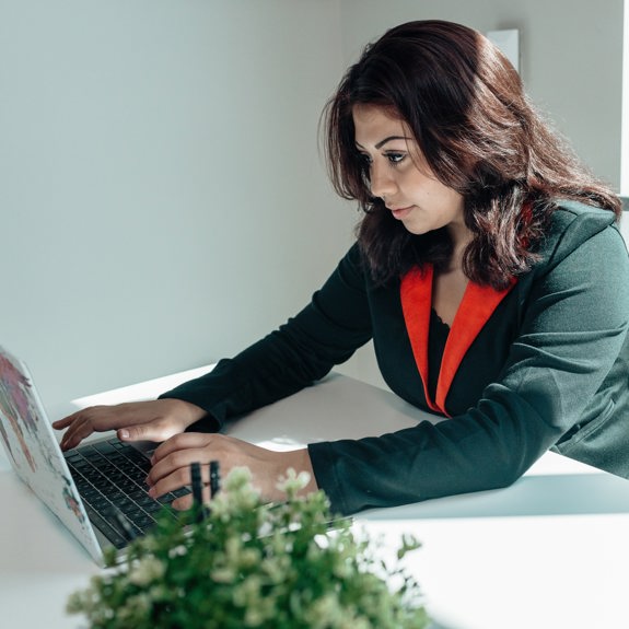 Woman typing on laptop